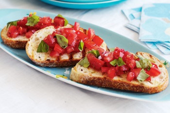 Toast layered with fresh tomatoes.