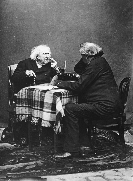 two men sitting at a table