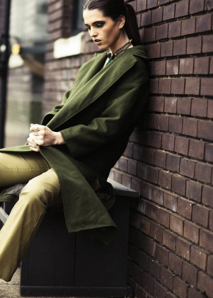woman wearing green coat