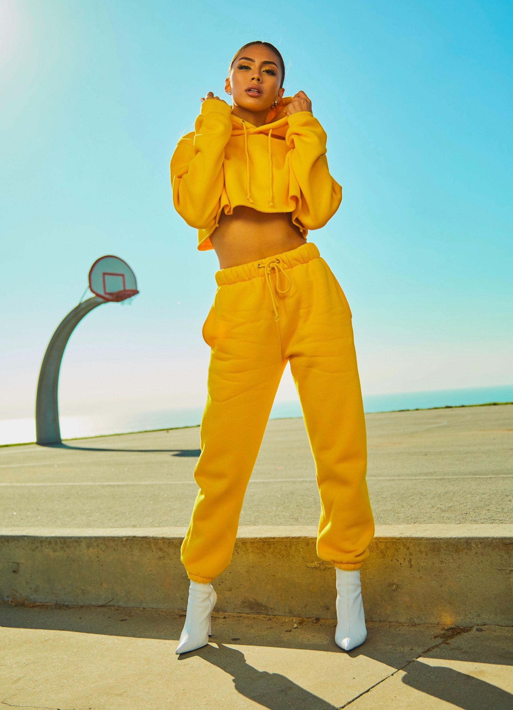 model with yellow sweats