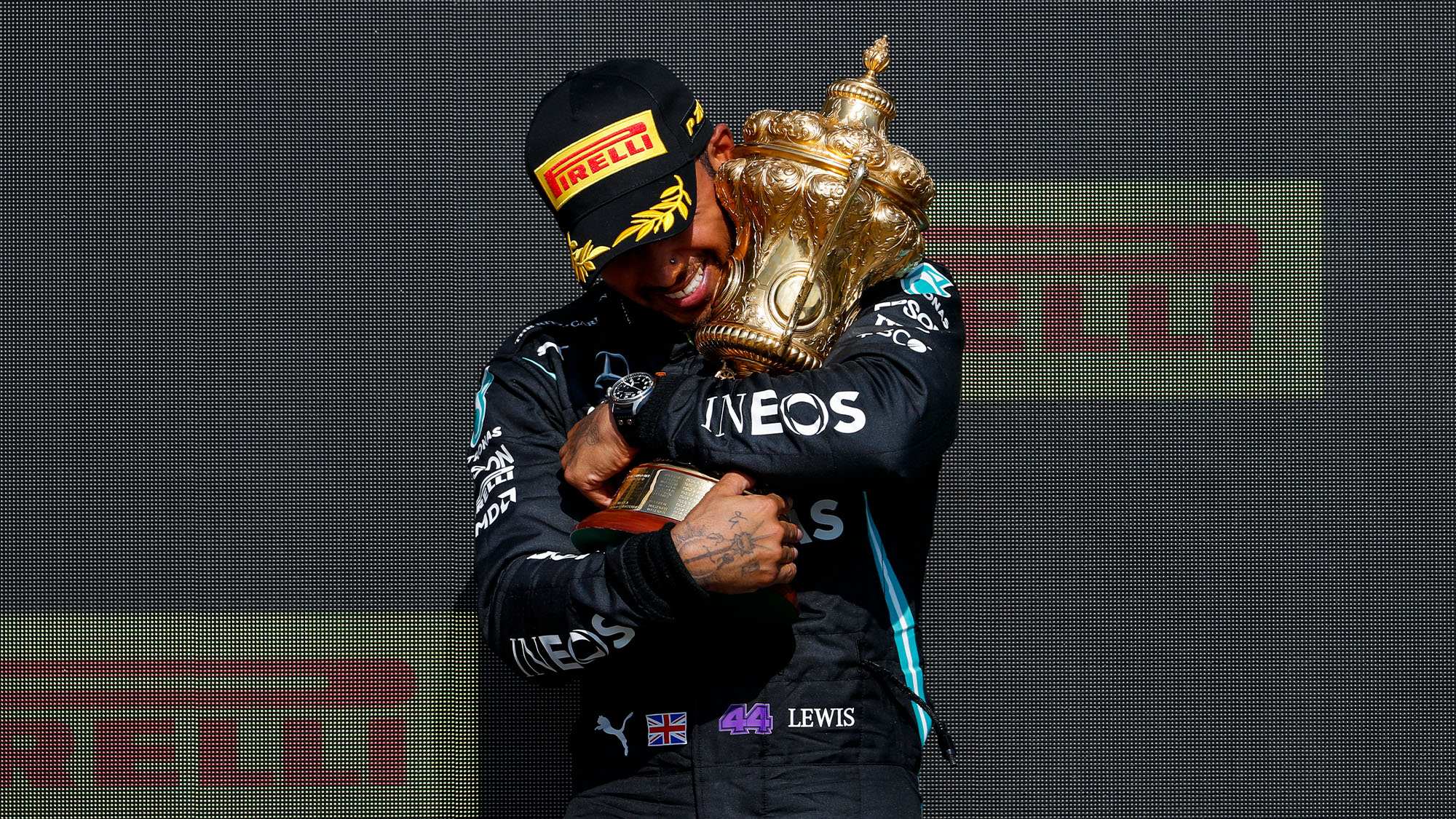 lewis hamilton hugging trophy