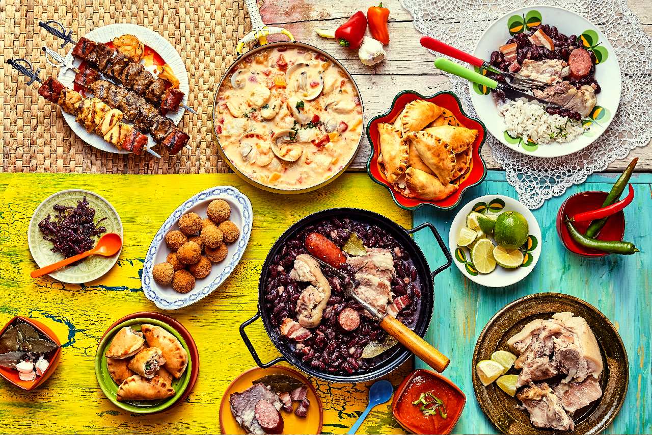 Table with multiple Brazilian dishes