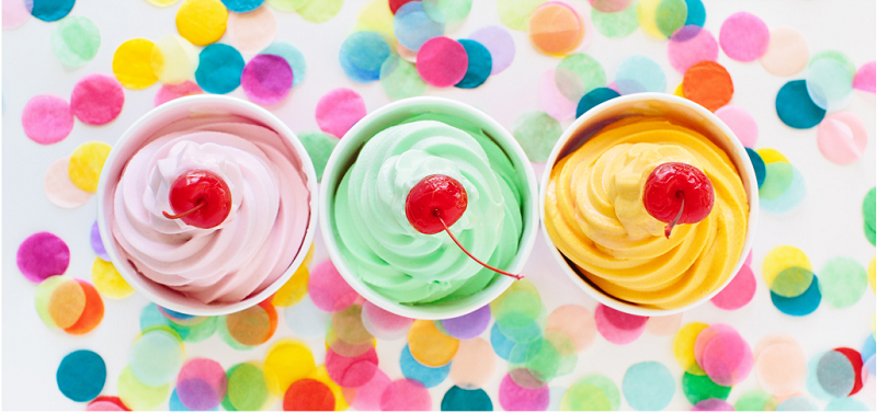 3 frozen yogurt cups with colorful background