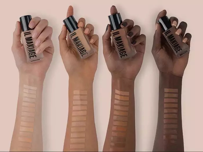 Arms with makeup foundation swatches on them
