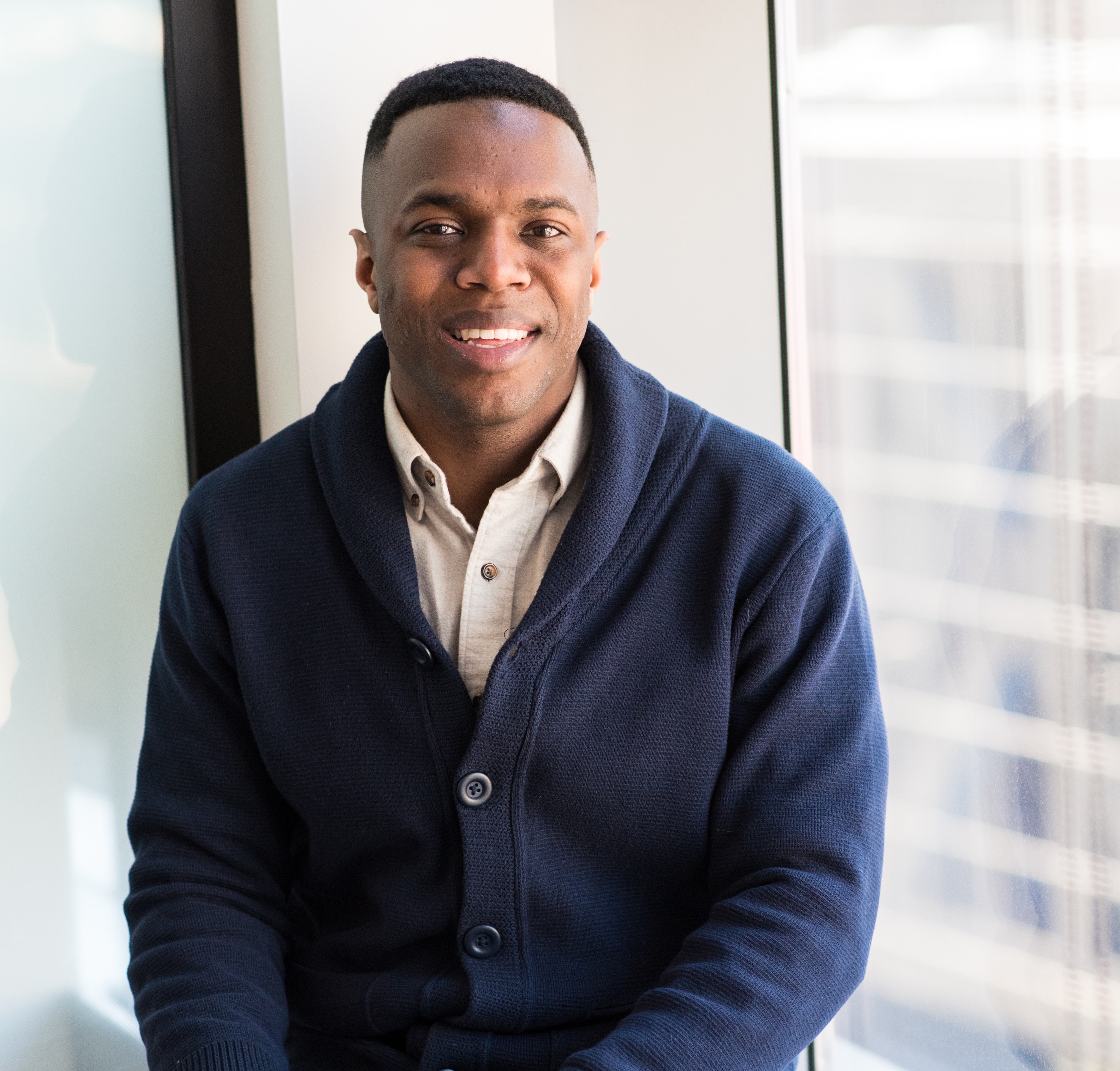 man sitting and smiling